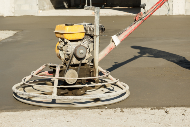 Concrete resurfacing machine being used by a worker on site